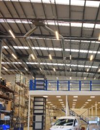 Warehouse with high-bay LED lighting over racking